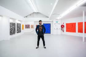 Sam Kissajukian and his painting
