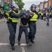 A man is detained during riots in Middlesbrough on Sunday (Picture: Ian Forsyth/Getty Images)