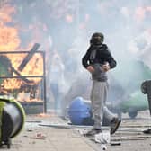 Anti-migration rioters set fire to the Holiday Inn Express in Manvers, South Yorkshire, which is being used as an asylum hotel, on Sunday (Picture: Christopher Furlong/Getty Images)