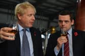 Both Boris Johnson and Douglas Ross let the Conservative party down (Picture: Daniel Leal/pool/AFP via Getty Images)