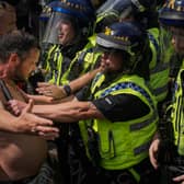 Police clash with right-wing protesters in Manchester's Piccadilly Gardens (Picture: Christopher Furlong/Getty Images)