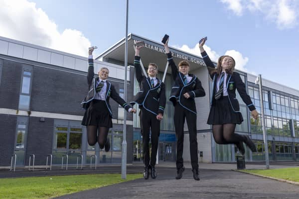 Pupils (from left to right) Erin Boothman, Charlotte Findlay, Dan Griffiths and Sean Bull celebrate receiving their exam results at Williamwood High School