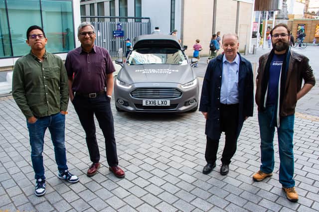 Professor Subramanian Ramamoorthy, second left, with, from left, colleagues Hector Cruz, Jim Duffin and Dr Alejandro Bordallo beside their car which is collecting data from Edinburgh's streets using cameras and sensors