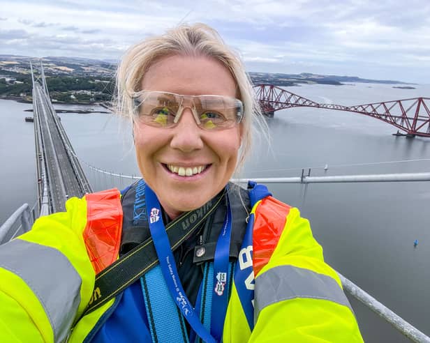 The Scotsman photographer/audio visual specialist Lisa Ferguson at the top of the Forth Road Bridge's south tower on Thursday