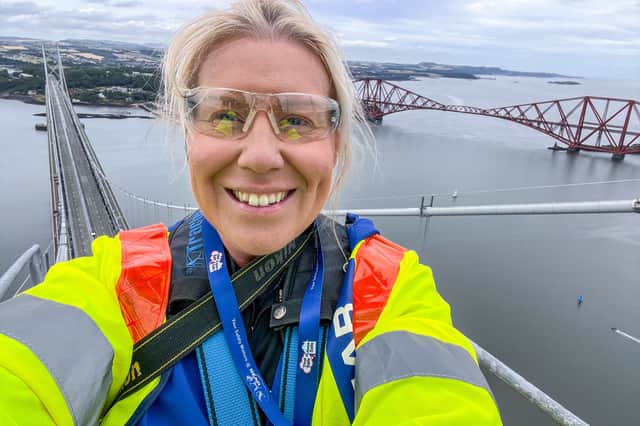 The Scotsman photographer/audio visual specialist Lisa Ferguson at the top of the Forth Road Bridge's south tower on Thursday