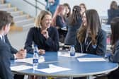 Education Secretary Jenny Gilruth chats to students at Madras College in St Andrews as they receive their exam results (Picture: Jane Barlow/PA)