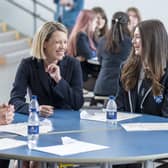Education Secretary Jenny Gilruth chats to students at Madras College in St Andrews as they receive their exam results (Picture: Jane Barlow/PA)