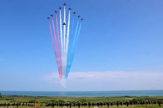 The British Royal Air Force's (RAF) aerobatic team, the "Red Arrows" and a Eurofighter Typhoon perform a flypast during the UK Ministry of Defence and the Royal British Legion's commemorative ceremony marking the 80th anniversary of VE Day. Picture: Chris Jackson /AFP via Getty Images