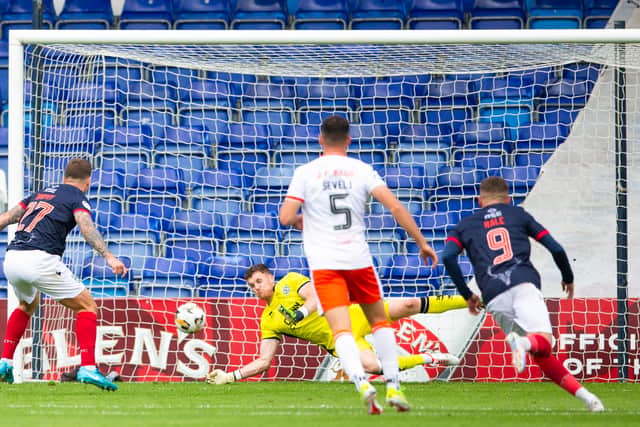 Dundee United goalkeeper Jack Walton’s saves a penalty away at Ross County.