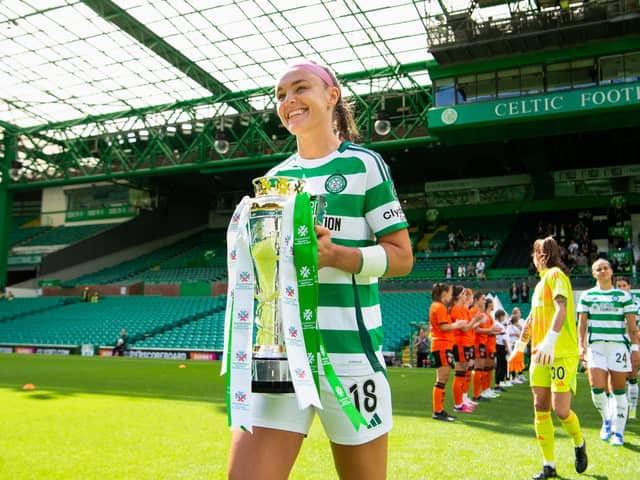 Celtic's Caitlin Hayes emerges with the SWPL trophy before the game against Dundee United. Cr: SNS Group.