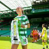 Celtic's Caitlin Hayes emerges with the SWPL trophy before the game against Dundee United. Cr: SNS Group.