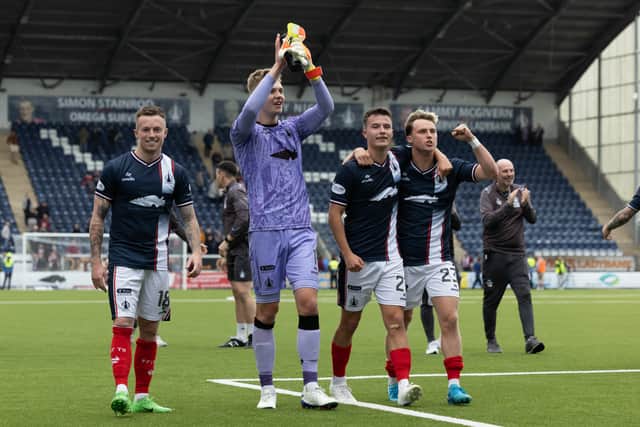 The Falkirk players take the acclaim of their supporters.