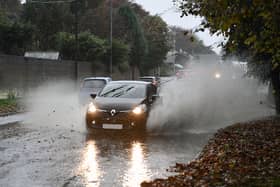 A car drives through heavy rain in Falkirk. Picture: Michael Gillen