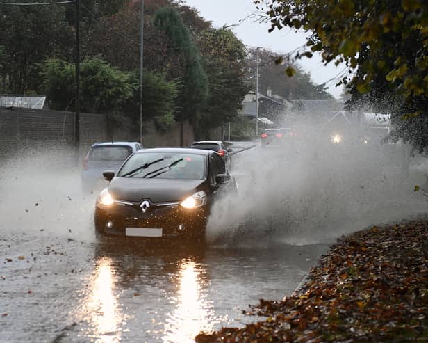 A car drives through heavy rain in Falkirk. Picture: Michael Gillen