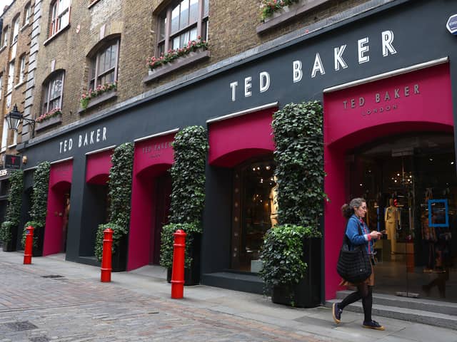 A woman walks past a Ted Baker store in Covent Garden, London (Photo: Peter Nicholls/Getty Images)
