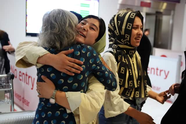 Lorna Norgrove, mother of aid worker Linda Norgrove meeting a group of 20 women from Afghanistan, who are now banned from education under the Taliban, after they arrived at Edinburgh Airport to complete their medical degrees in Scotland.