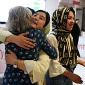 Lorna Norgrove, mother of aid worker Linda Norgrove meeting a group of 20 women from Afghanistan, who are now banned from education under the Taliban, after they arrived at Edinburgh Airport to complete their medical degrees in Scotland.