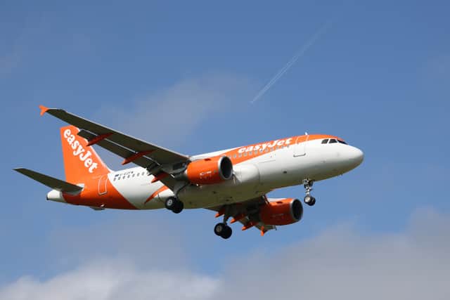 An easyJet aeroplane comes in for landing at Gatwick Airport.