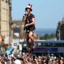 A juggling performer eats a potato on Edinburgh's Royal Mile during the city's Festival Fringe. Picture: Jeff J Mitchell/Getty Images