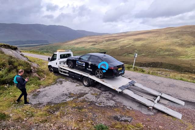 The car being recovered from near Applecross by a Lochcarron Garage tow truck