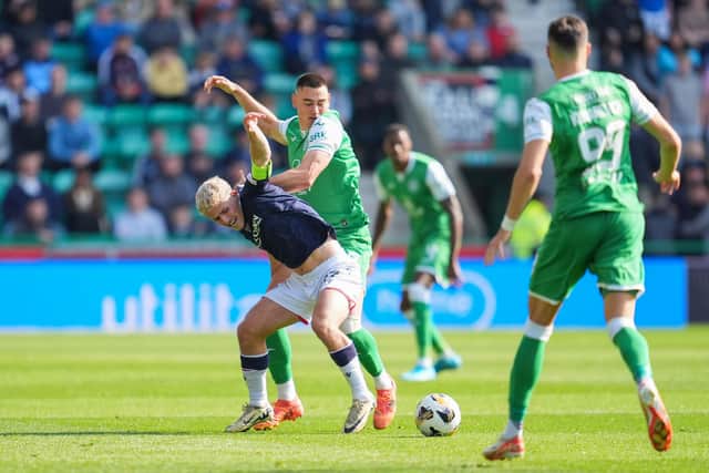 Dundee's Luke McCowan - a transfer target for Hibs - is tackled by Lewis Miller during the 2-2 draw at Easter Road.  (Photo by Simon Wootton / SNS Group)