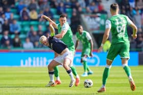 Dundee's Luke McCowan - a transfer target for Hibs - is tackled by Lewis Miller during the 2-2 draw at Easter Road.  (Photo by Simon Wootton / SNS Group)