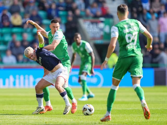 Dundee's Luke McCowan - a transfer target for Hibs - is tackled by Lewis Miller during the 2-2 draw at Easter Road.  (Photo by Simon Wootton / SNS Group)