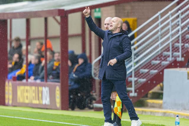 Steven Naismith gives orders to his Hearts players.