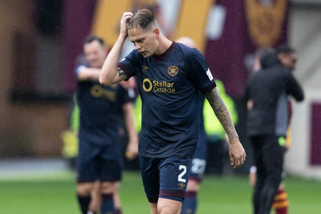 Hearts defender Frankie Kent trudges off after the Jambos' 3-1 defeat by Motherwell.