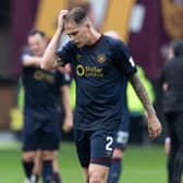 Hearts defender Frankie Kent trudges off after the Jambos' 3-1 defeat by Motherwell.