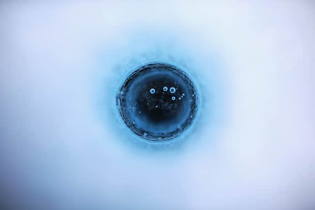 Air bubbles rise in surface meltwater on the ice sheet that covers most of Greenland (Picture: Joe Raedle/Getty Images)