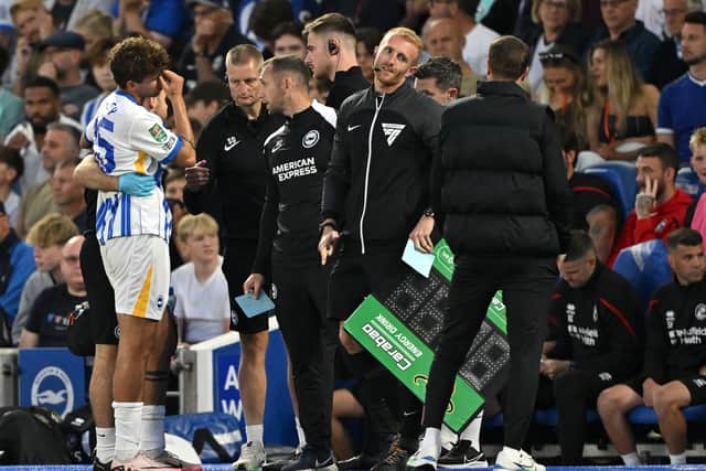 Matt O'Riley is distraught after being substituted on nine minutes due to injury on his Brighton debut. (Photo by Mike Hewitt/Getty Images)