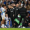 Matt O'Riley is distraught after being substituted on nine minutes due to injury on his Brighton debut. (Photo by Mike Hewitt/Getty Images)