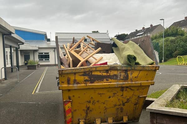 A skip full of classroom equipment in Midlothian
