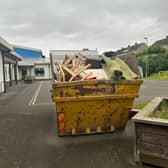 A skip full of classroom equipment in Midlothian