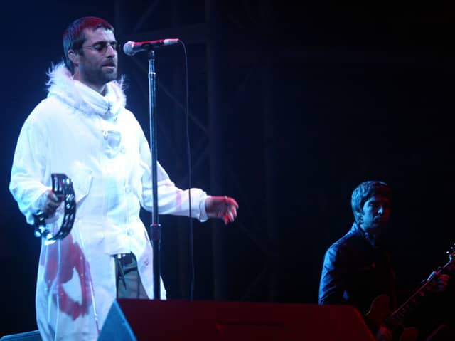 Oasis on the Pyramid Stage at Glastonbury in 2004. Photo: Matt Cardy/Getty Images