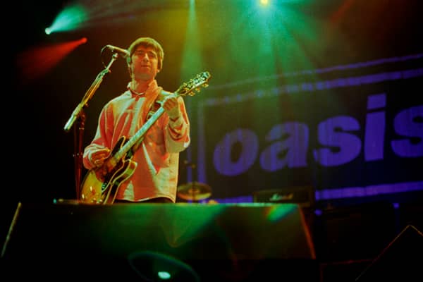 Noel Gallagher of Oasis performs on stage. Photo: Stacia Timonere/Getty Images