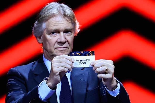 Rangers are drawn out of the hat for the UEFA Europa League draw by forrmer Atalanta player Glenn Stromberg. (Photo by VALERY HACHE/AFP via Getty Images)