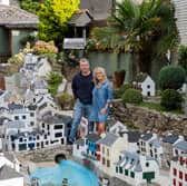 Lee and Julie Gregory with the model of Polperro in Cornwall which is now up for sale.
