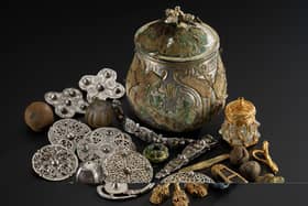 The lidded vessel from the Galloway Hoard and the Viking-age treasures it contained. Image © National Museums Scotland 