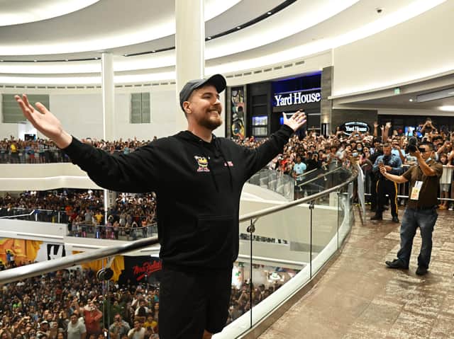 MrBeast poses with fans at the launch of the first physical MrBeast Burger Restaurant in 2022. Photo: Dave Kotinsky/Getty Images for MrBeast Burger