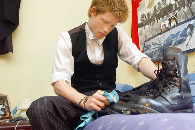 Prince Harry polishes his own Combined Cadet Force (CCF) boots in his room at Eton College, in 2003. The prince was among thousands of school pupils who have been part of the Combined Cadet Force. (Picture: Kirsty Wigglesworth)