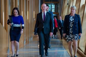 Deputy First Minister Kate Forbes, First Minister John Swinney and Finance Secretary Shona Robison.