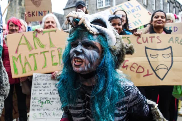 Demonstrators protest outside the Scottish Parliament against the cuts to the performing arts industry in Scotland by the Scottish Government. Picture: Lisa Ferguson