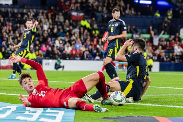 Scotland's Grant Hanley looks dejected after giving away a penalty in injury time as Poland claimed a 3-2 victory. (Photo by Craig Foy / SNS Group)