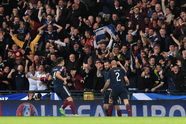 Steven Fletcher celebrates a goal against Poland at Hampden Park in 2015. Cr: SNS Group.