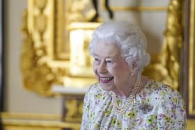 The late Queen Elizabeth II smiling as she arrives to view a display of artefacts from British craftwork company, Halcyon Days, to commemorate the company's 70th anniversary in the White Drawing Room at Windsor Castle, Berkshire, in 2022. A committee will consider a potential Scottish memorial project for the late Queen, the First Minister has said.
