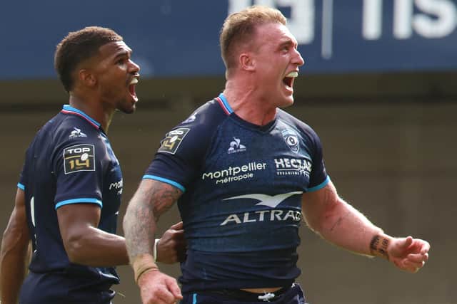 Stuart Hogg celebrates after scoring a try on his Montpellier debut in the French Top 14 defeat to Lyon. (Photo by PASCAL GUYOT/AFP via Getty Images)
