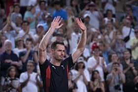 Sir Andy Murray cries and waves to the spectators after he and his partner Daniel Evans were defeated by Taylor Fritz and Tommy Paul of the United States in the men's doubles quarter finals tennis match, at the 2024 Summer Olympics in Paris. (AP Photo/Andy Wong)