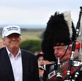 A piper plays as Donald Trump opens his Trump Turnberry golf resort in 2016 (Picture: Jeff J Mitchell)